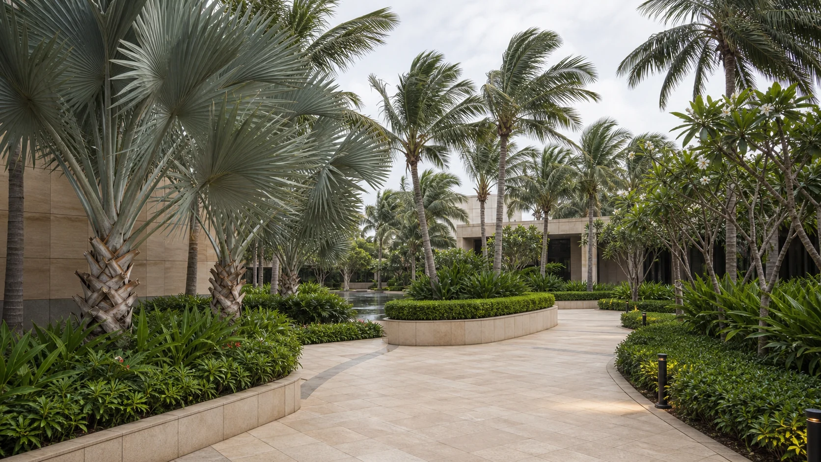 Chennai coastal commercial landscape with salt tolerant planting, palms, and durable pedestrian hardscape.