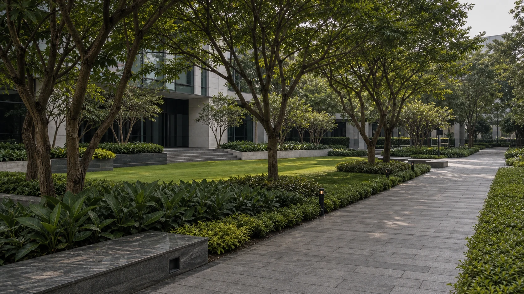 Pune commercial landscape with drought-aware planting, shade trees, and clean circulation zones.