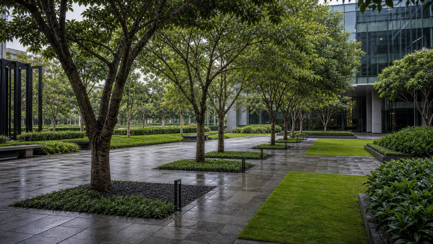 Corporate campus courtyard with structured planting, shaded paths, and workplace outdoor seating zones.