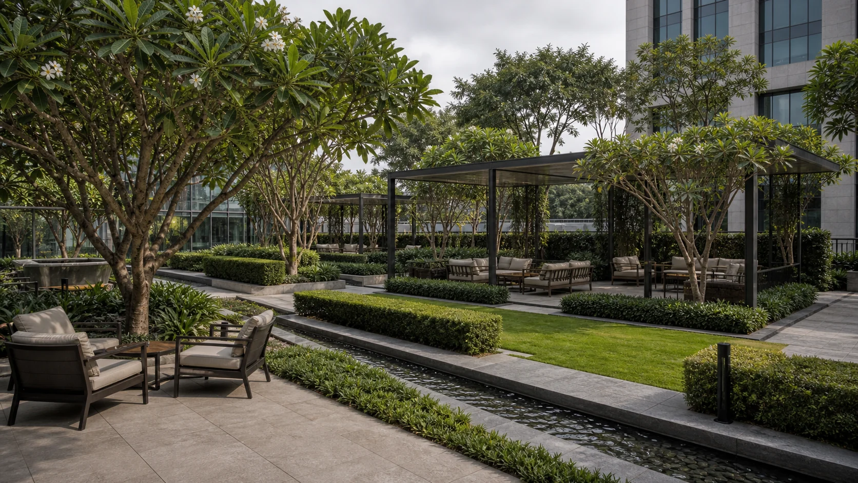 Corporate garden promenade with shade trees, lawn edges, and structured workplace circulation.