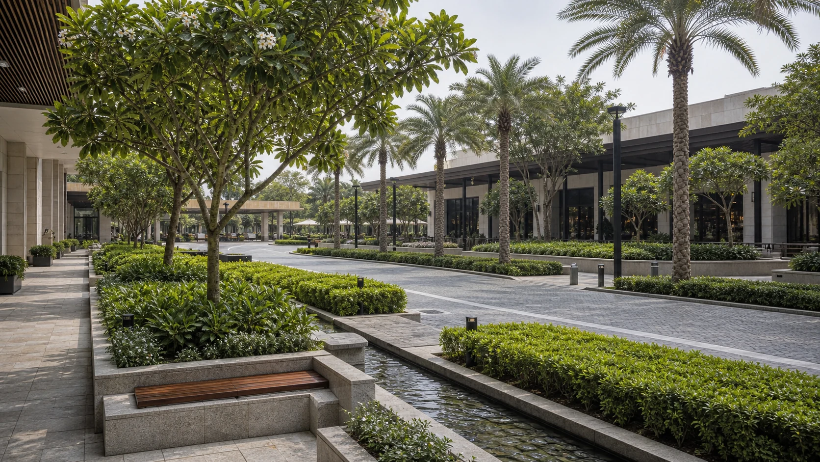 Mall plaza landscape with seating, ornamental planting, shade trees, and active public realm design.