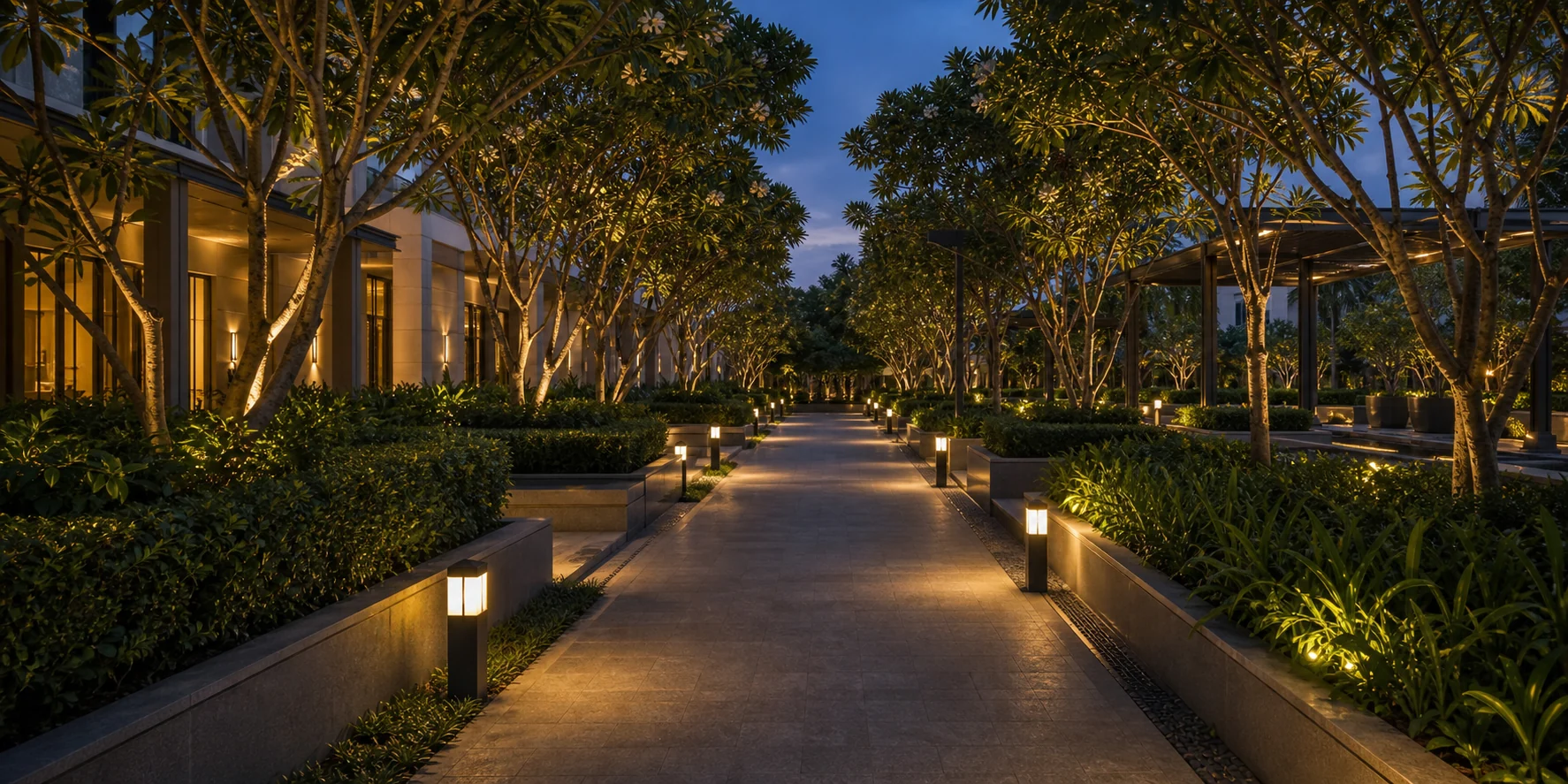 Mature commercial garden with tree canopy, pathway, and refined planting for trust and company profile pages.