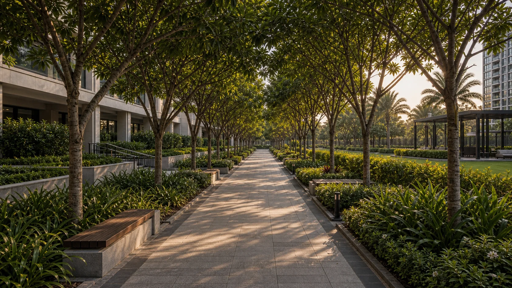 Layered shrub and groundcover planting in a steel-edged commercial bed with visible drip emitters.