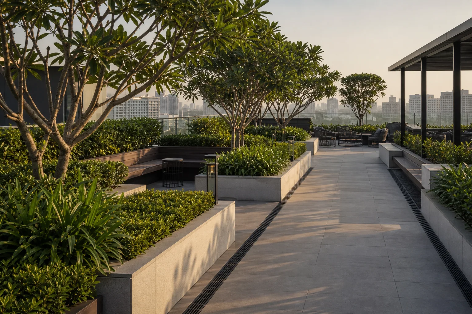 Commercial terrace garden planter build with layered shrubs and paved amenity deck coordination.