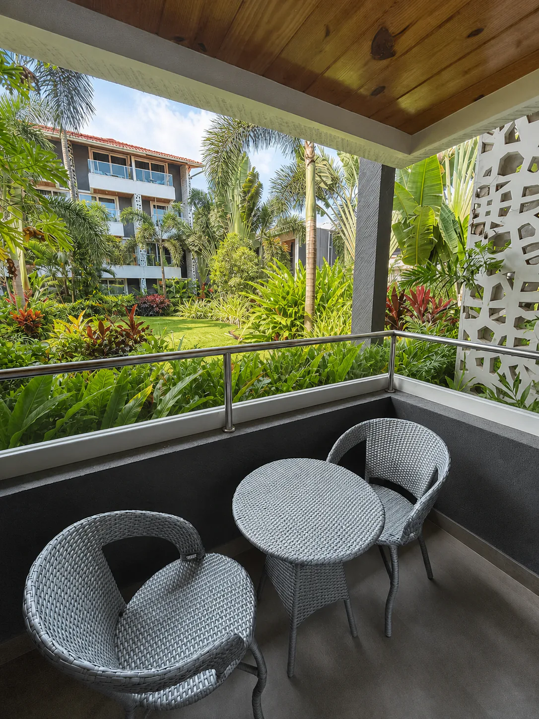 Hyatt Place Goa Candolim elevated balcony view over Hyatt Place Goa's mature tropical garden