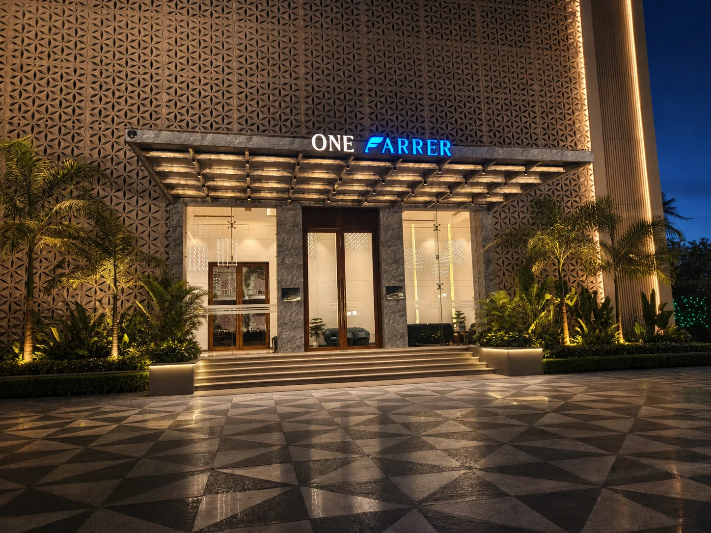 One Farrer main entrance at blue hour with structured tropical planting, patterned paving and balanced architectural lighting.