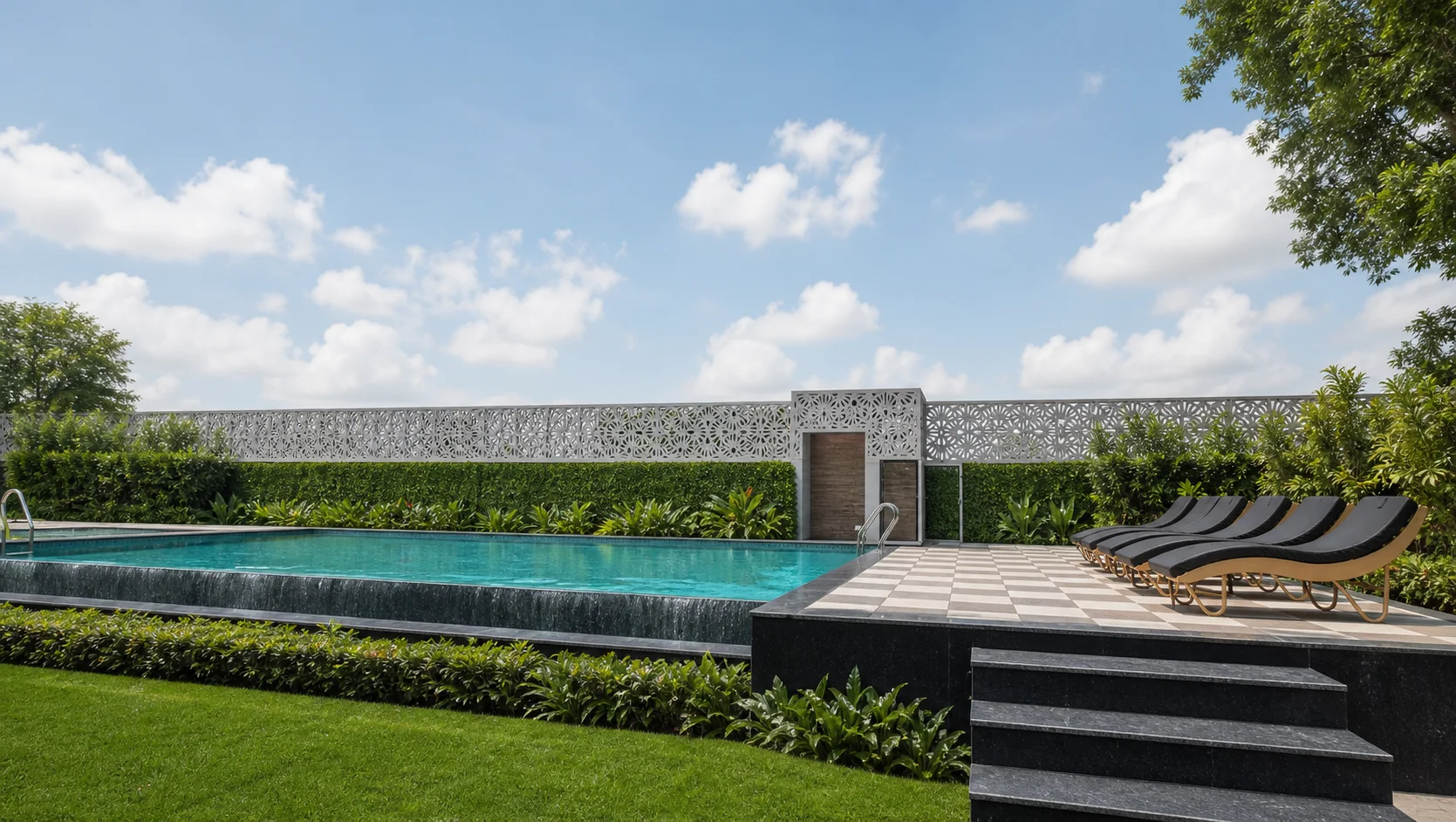 One Farrer pool terrace with clear turquoise water, cascade edge, aligned loungers and refined boundary planting.