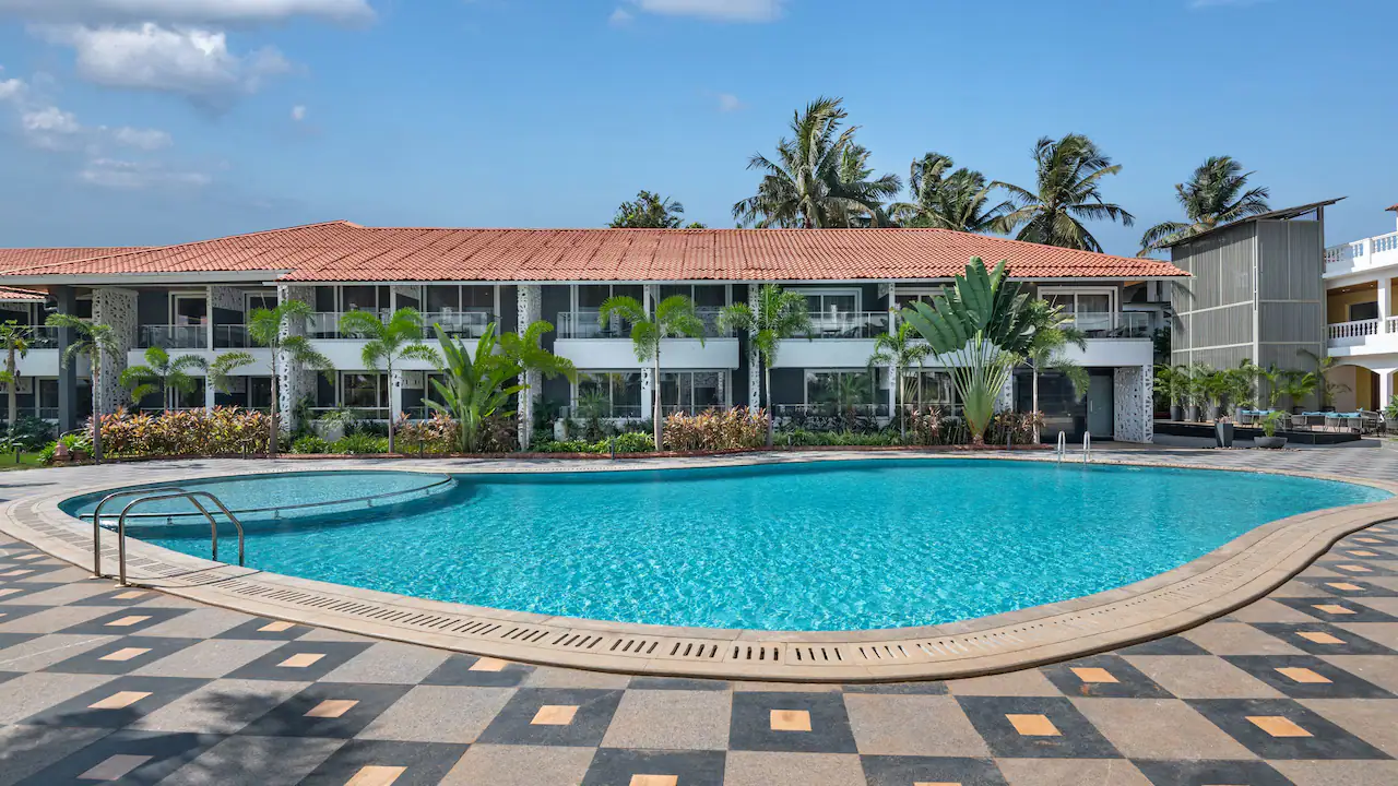 Lush poolside landscaping at Hyatt Place Goa Candolim designed by Four Leaf Landscape.