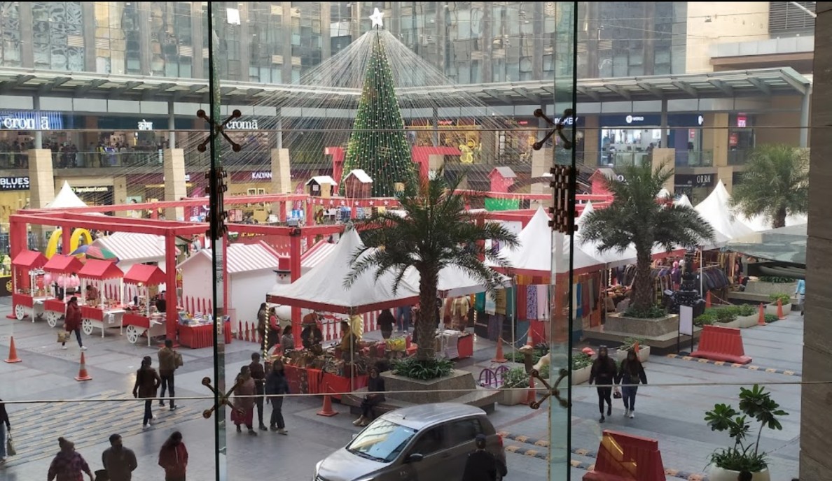 Christmas-themed landscaping at Vegas Mall Delhi with festive stalls and decorations.