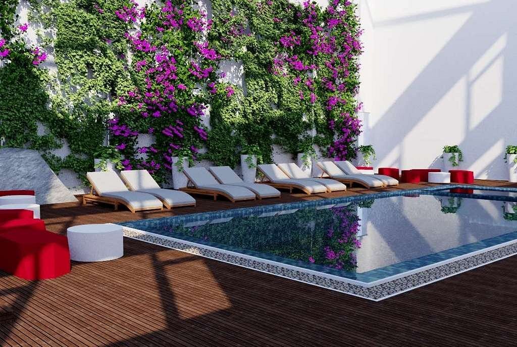 Lush floral wall and poolside lounging area at Ramada Darjeeling, designed by Four Leaf Landscape.